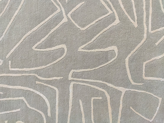 The RAMSHA HOME Modern Handmade Rug – HTWV-38 (250x350 CM) features a beige background with an abstract pattern of intersecting light lines, offering a contemporary geometric design perfect for modern interiors.