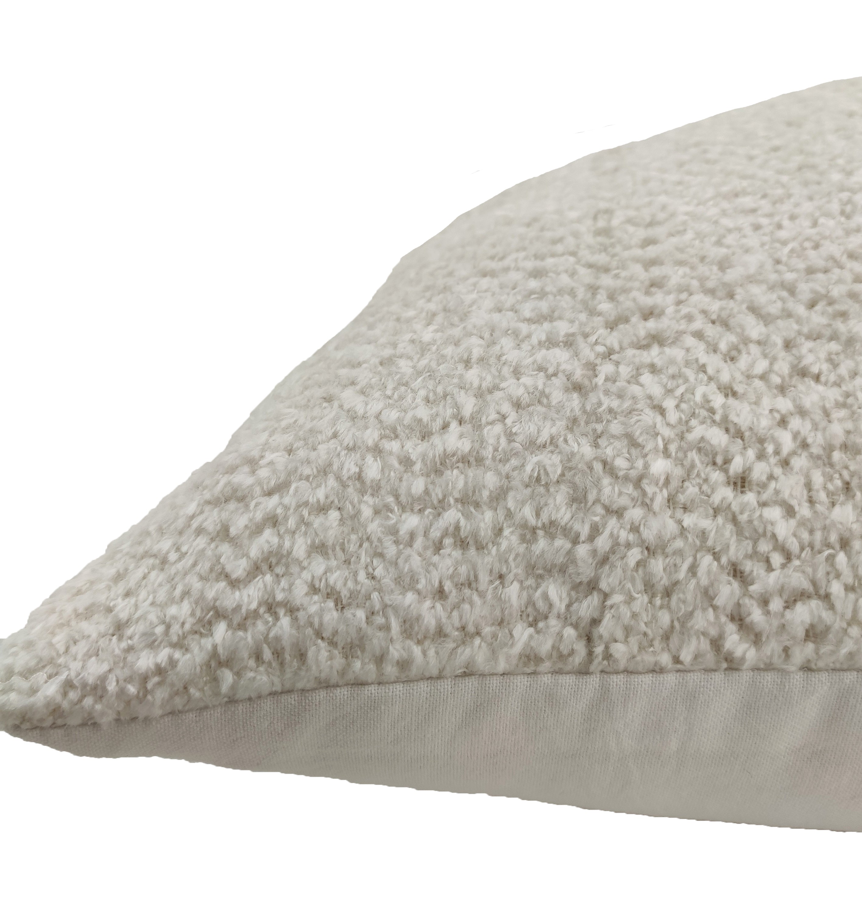 The RAMSHA HOME Boho Cushion With Small Furr features a beige textured, soft woven top and smooth light side, filled with poly fill cotton, set against a white background.