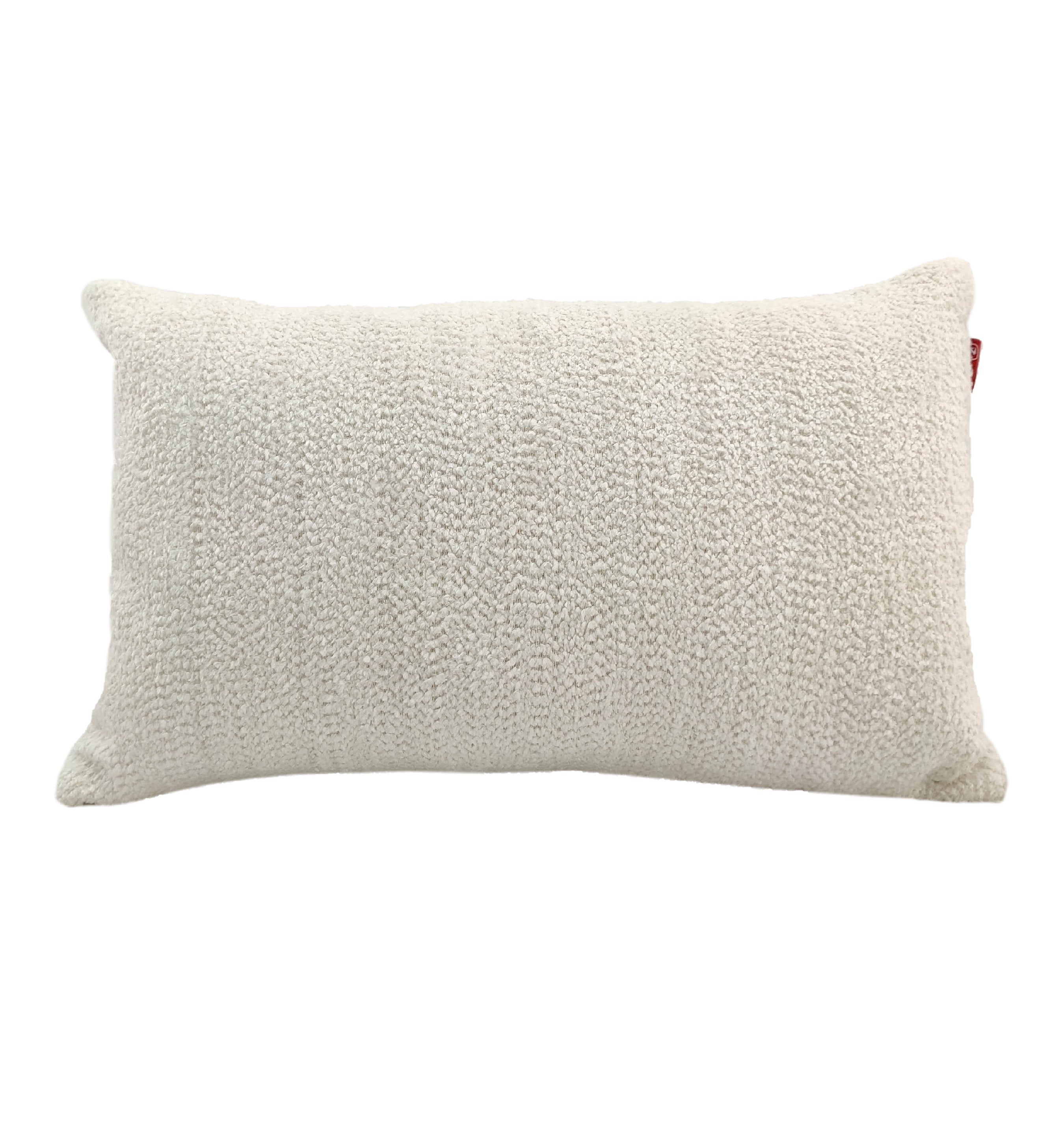 The RAMSHA HOME Boho Cushion With Small Furr is a rectangular, off-white textured throw pillow with plush poly fill cotton, featuring a knitted pattern and perfect for cozy, boho spaces. Displayed against a plain white background.