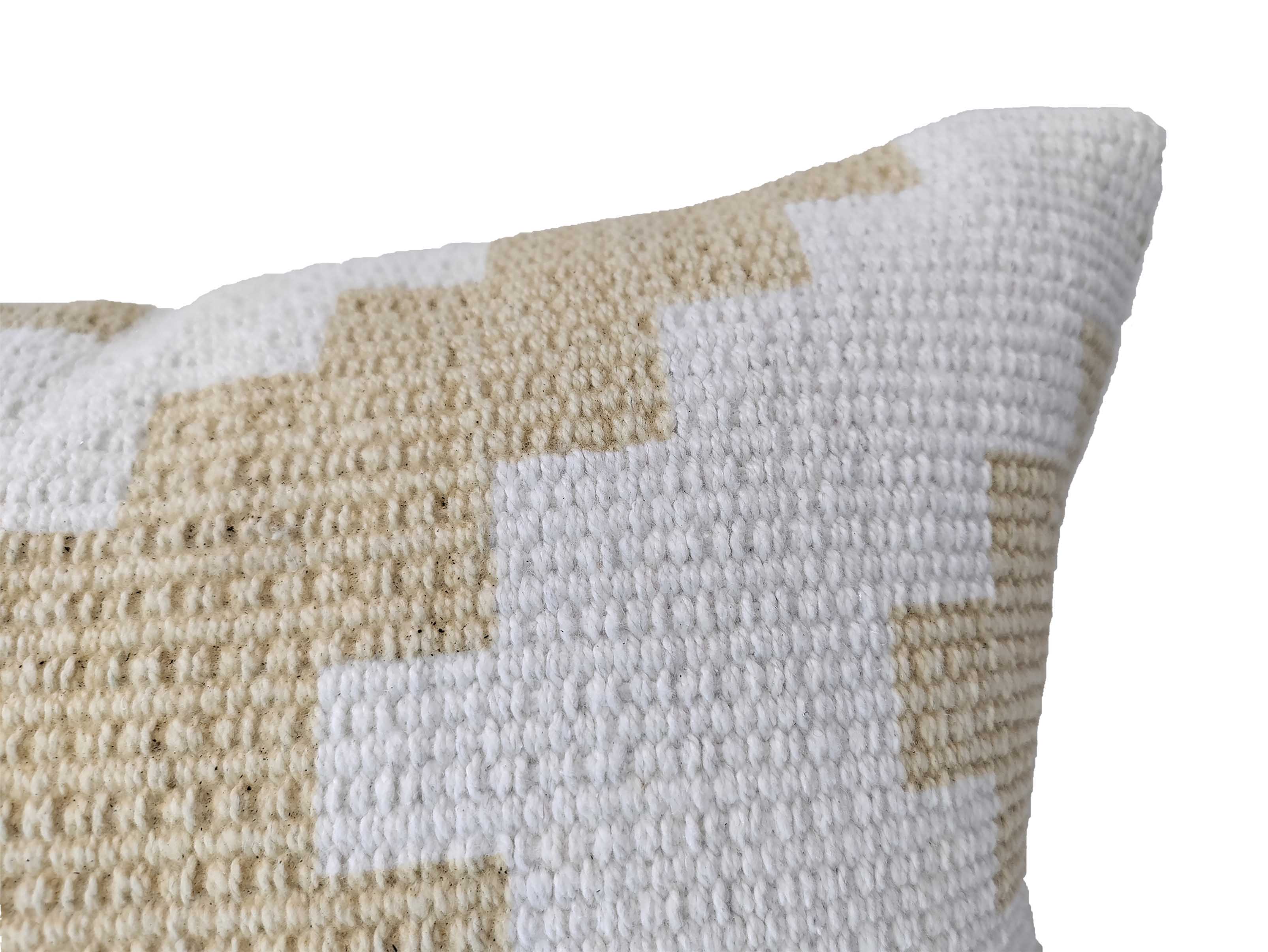 Close-up of RAMSHA HOME's Zigzag Design Pattern Cotton Cushion CS-179, showing its beige and white geometric pattern with textured stitches and a bold zigzag design against a white background.