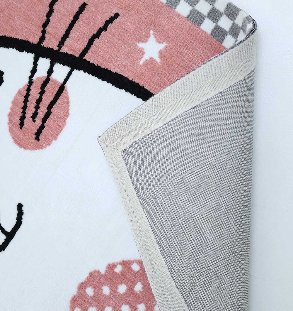 A close-up of the RAMSHA HOME Pink Cat Kids Rug (120x180cm) shows its playful kitten design in black, pink, and white on a pink background. The corner is folded to reveal the grey and white underside. Model: KD-002.
