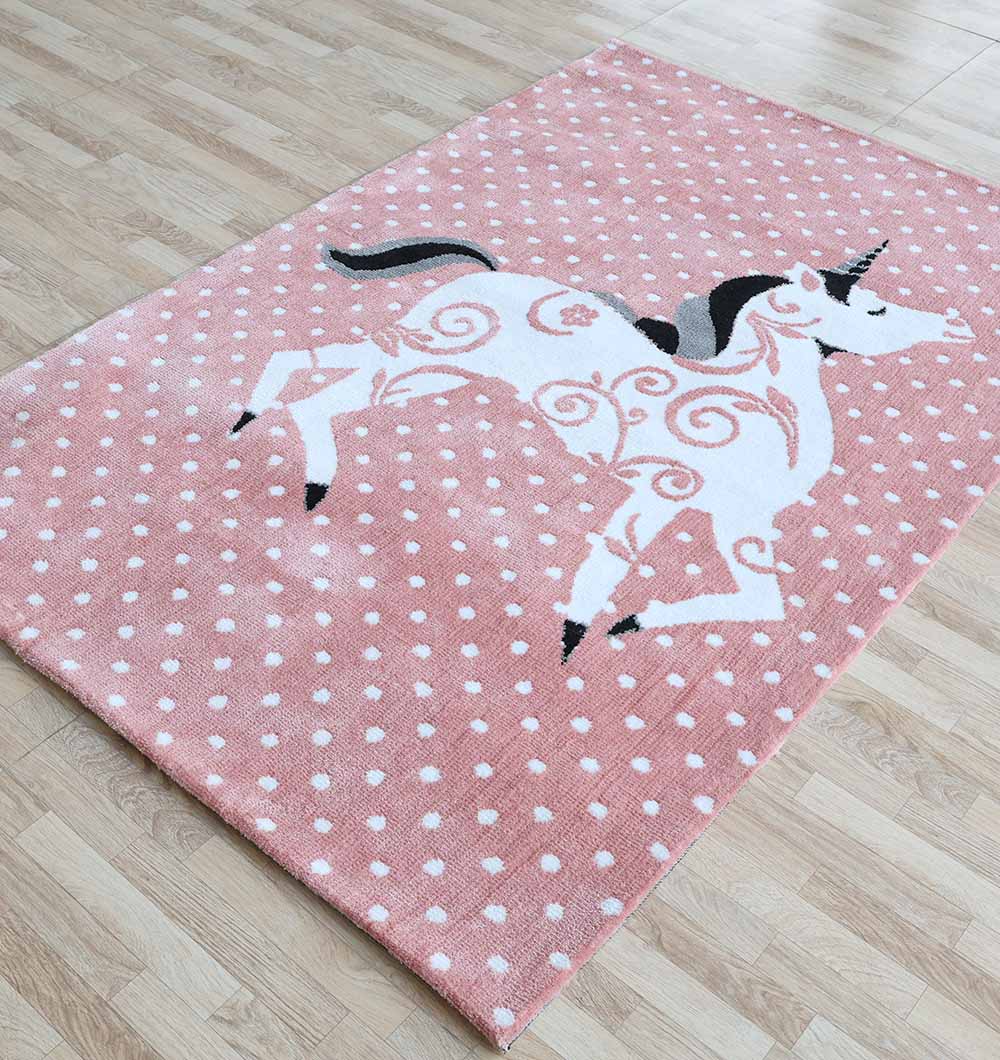 The RAMSHA HOME Unicorn Kids Rug - Pink Fantasy Playroom Area Carpet KD 004 (120X180 cm) features a charming unicorn with black mane and tail among white polka dots—perfect for kids’ bedrooms or playrooms on light wood floors.
