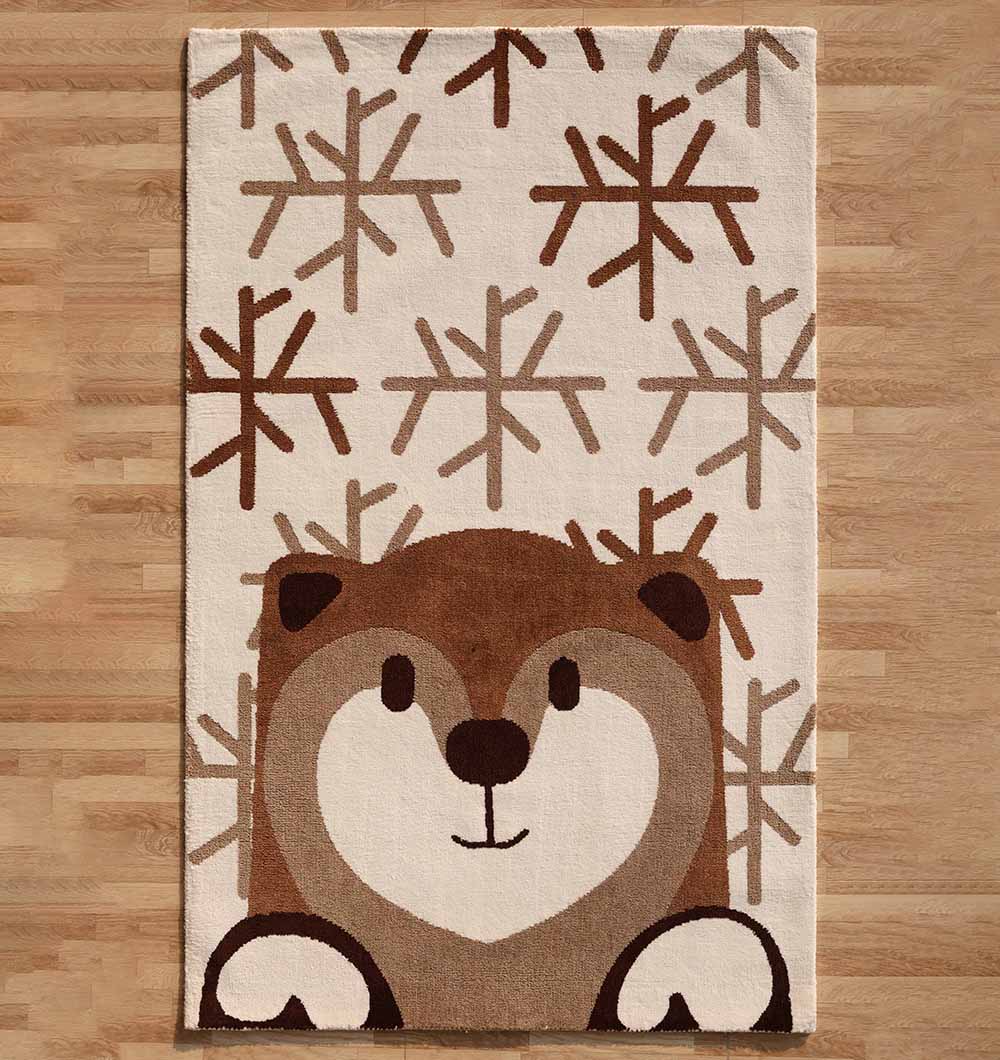 The RAMSHA HOME Kids Bear Face Beige & Brown Rug – KD 014 features a cartoon bear face and paws with brown snowflake patterns on a cream background, shown here on a wooden floor.