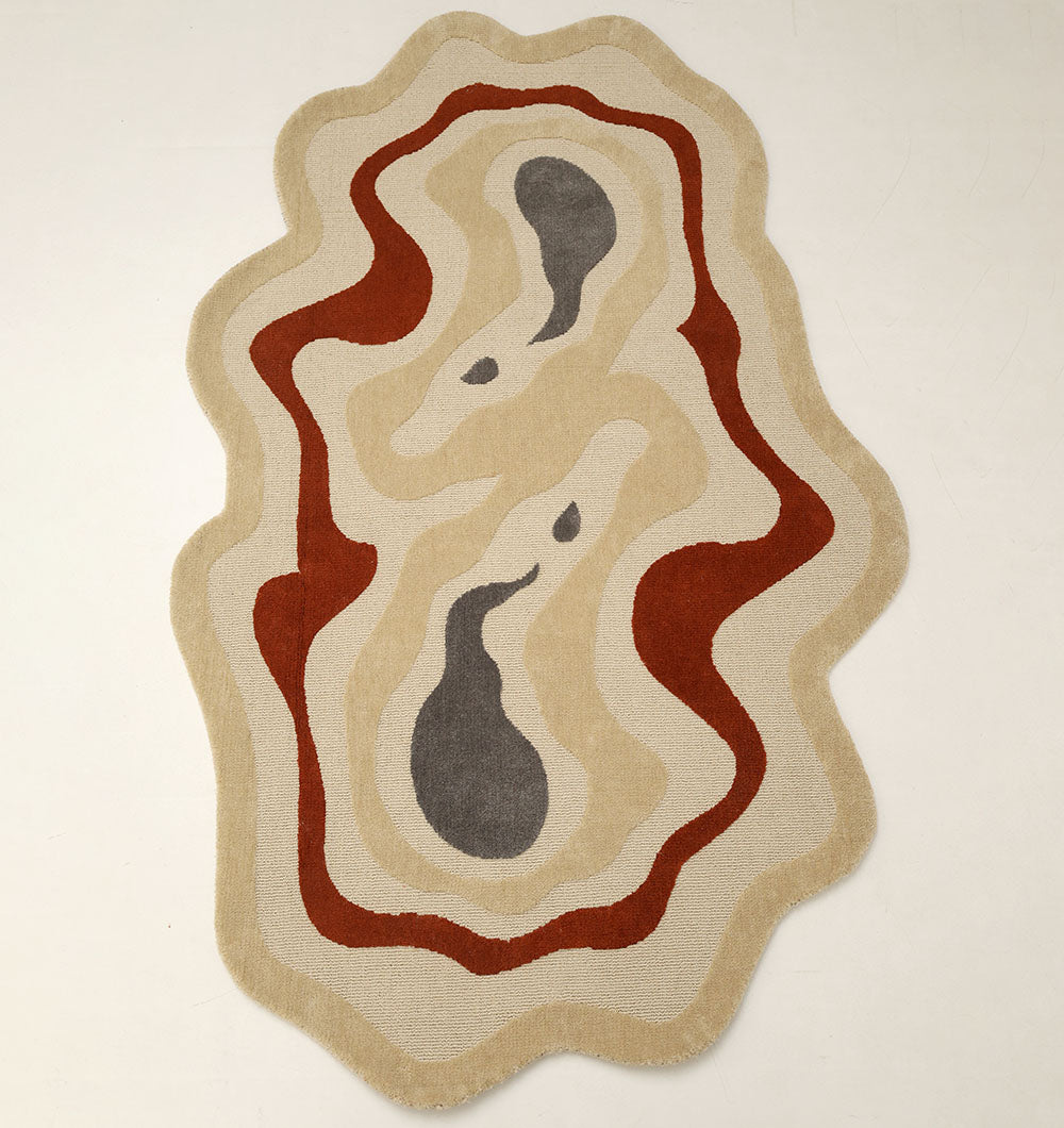 The RAMSHA HOME Amoeba Shaped Multi Color Rug (130x200 cm, KD 016) features wavy layered patterns in beige, tan, brown, red, and dark gray with a high-low pile and organic form—perfect for adding contemporary style to any space.