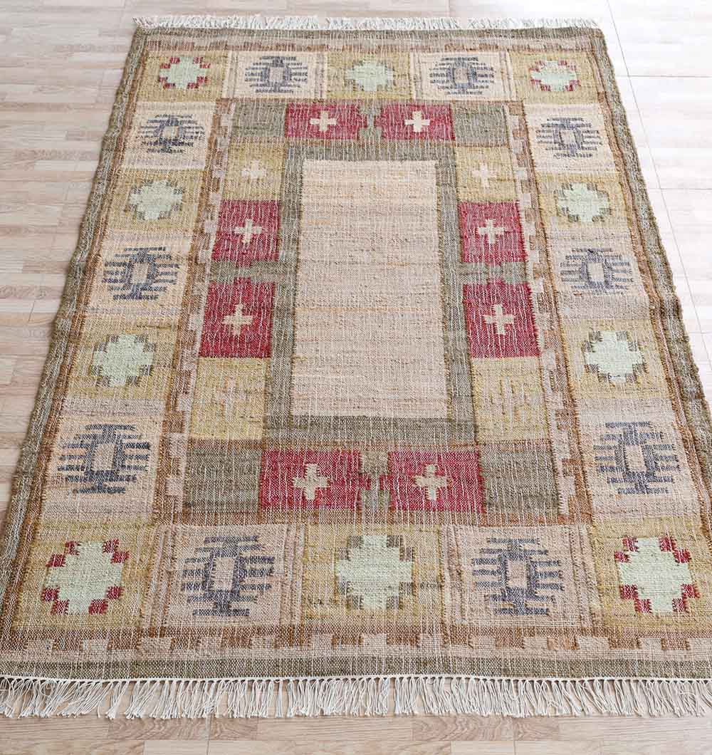 The Symmetrical Bordered Traditional Kilim Rug - KLM 007 (170x240cm) by RAMSHA HOME features a beige central panel framed by geometric earthy patterns in red, yellow, green, and blue with decorative fringes on both short ends.