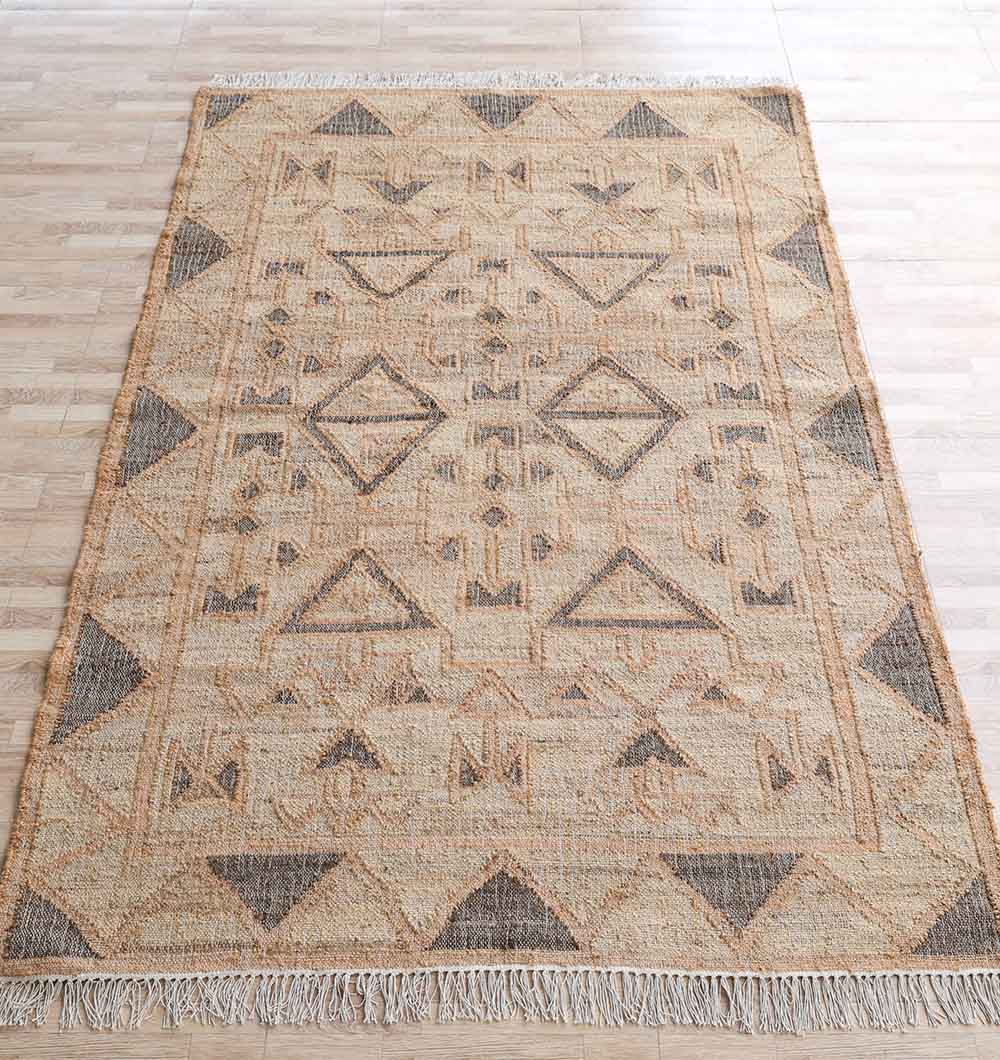 The RAMSHA HOME Minimalist Neutral Jute Tribal Kilim Rug (KLM 008, 170x240cm) in beige and brown features geometric diamonds, triangles, and fringe on short edges, displayed on a light wooden floor.