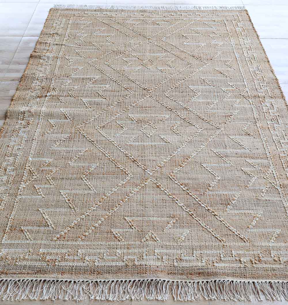 The RAMSHA HOME Jute Cotton Blend Kilim Rug (KLM 012, 170 x 240 cm) features a vintage-inspired beige flatweave with subtle diamond and triangle patterns plus fringed edges, perfect for adding charm to any light-colored floor.