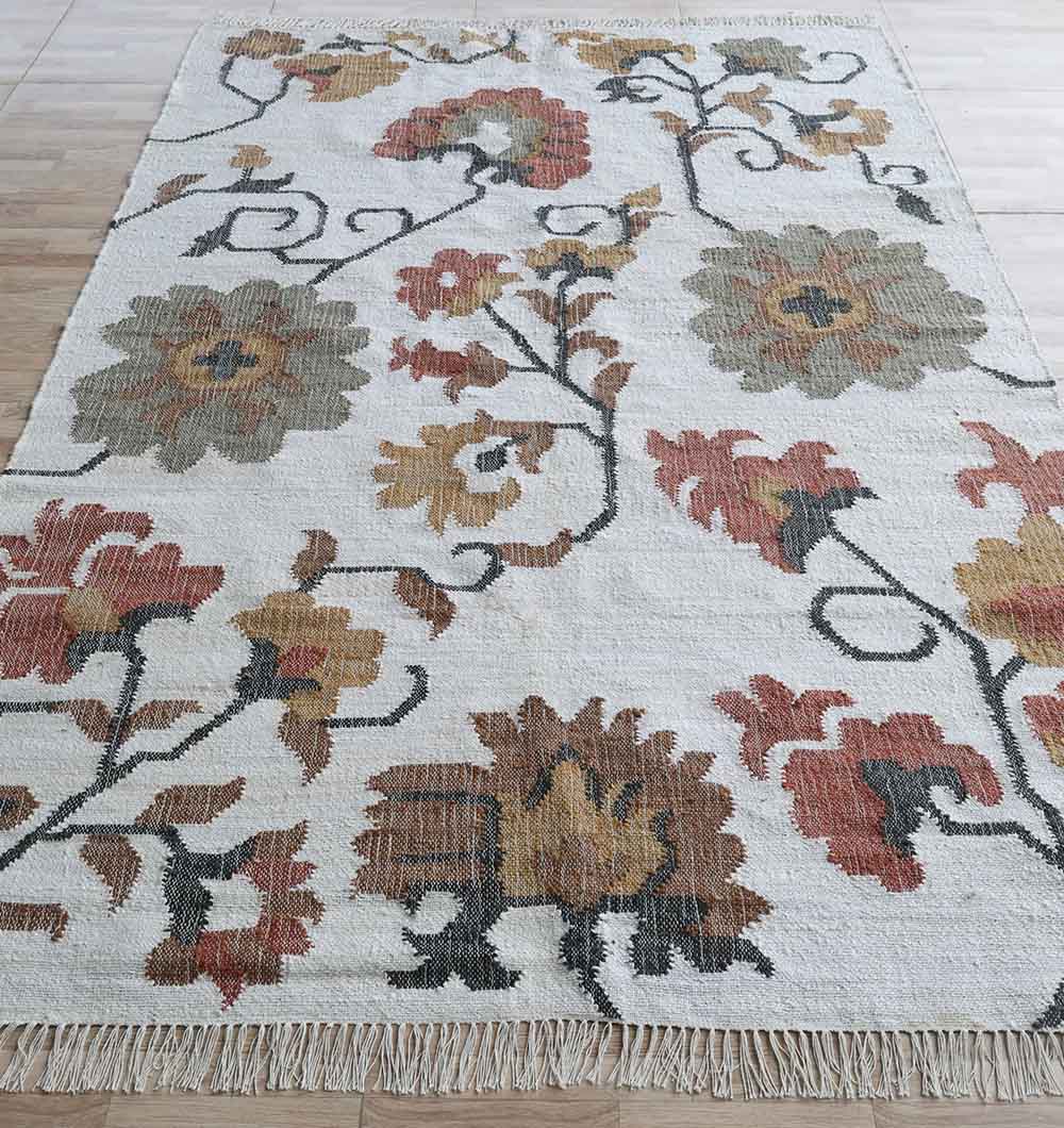 The RAMSHA HOME Kilim Rug – Multicolor Floral Handmade Flatweave Carpet KLM-021 features a cream background with large red, gold, green, and brown floral patterns, short fringed edges, and pairs beautifully with light wood floors.