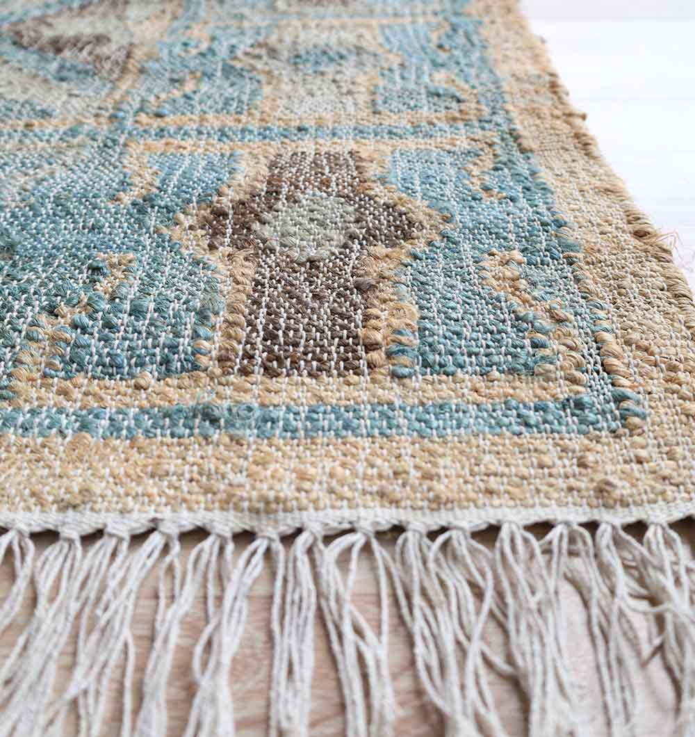 Close-up of the RAMSHA HOME Handmade Kilim Rug 170x240 cm (KLM-023), showing its multicolor geometric design and fringed edge. The rug’s detailed texture and craftsmanship are clearly highlighted.