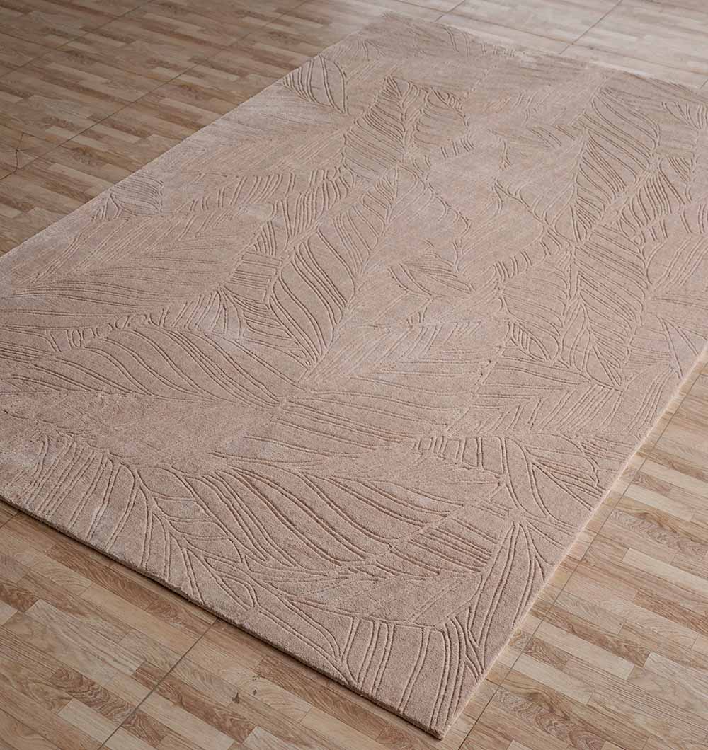 The RAMSHA HOME Decorative Rectangle Handmade Beige Area Rug (200x300 cm, LKH-038) features an embossed leaf pattern and a neutral texture, adding a subtle decorative touch to the light wood floor.