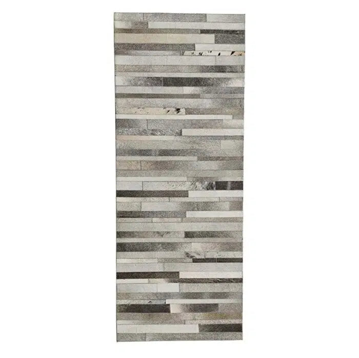 The RAMSHA HOME Grey Color Kitchen Decor Leather Rug - LR 004 features narrow, horizontal strips in shades of gray and beige, offering a modern, textured look that echoes contemporary neutral decor.
