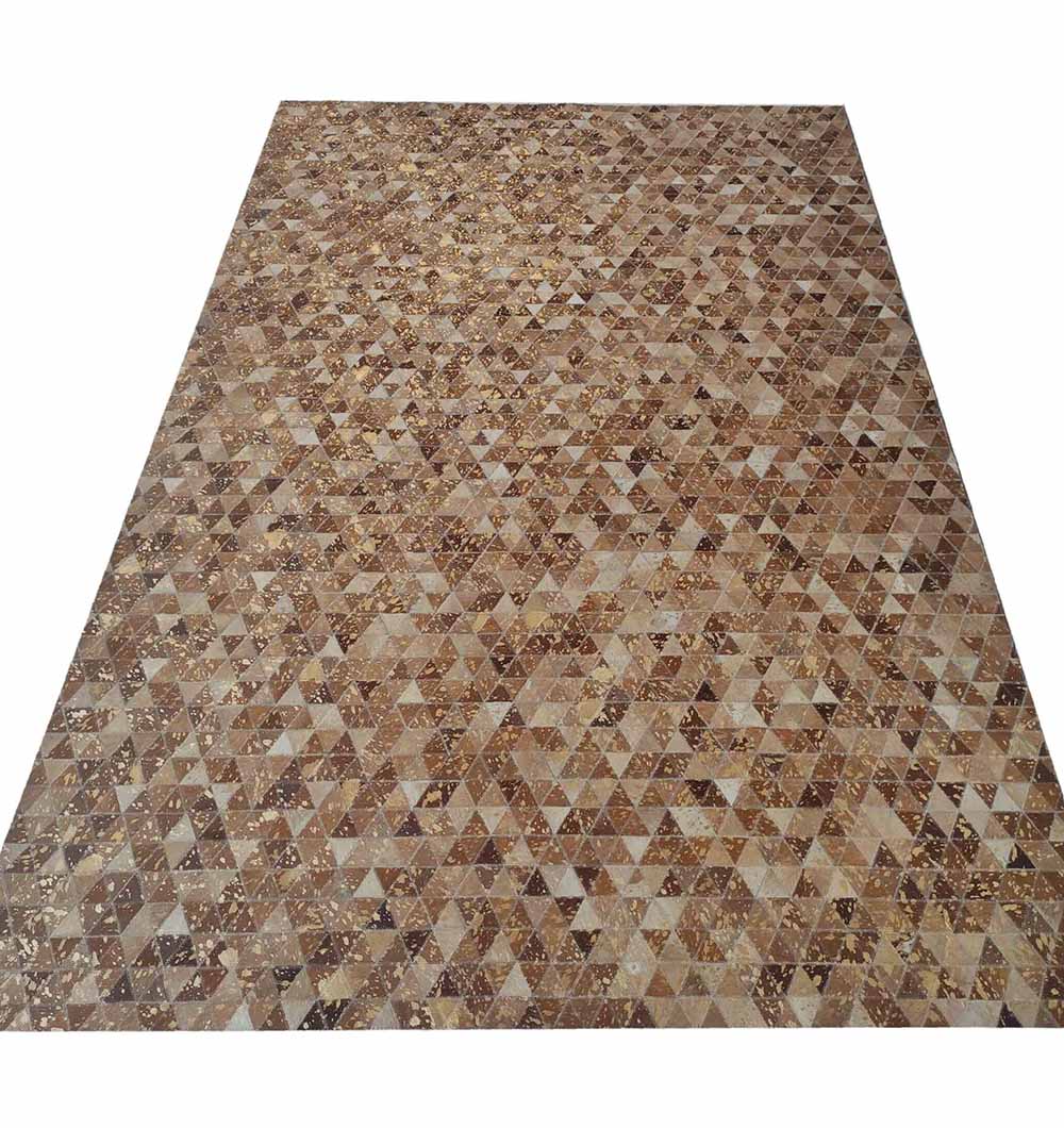 The Amazing Grey & Tan Color Playroom Leather Rug - LR 006 features a rectangular surface with a geometric mosaic of small brown and beige triangular tiles, creating a textured and intricate leather rug design.
