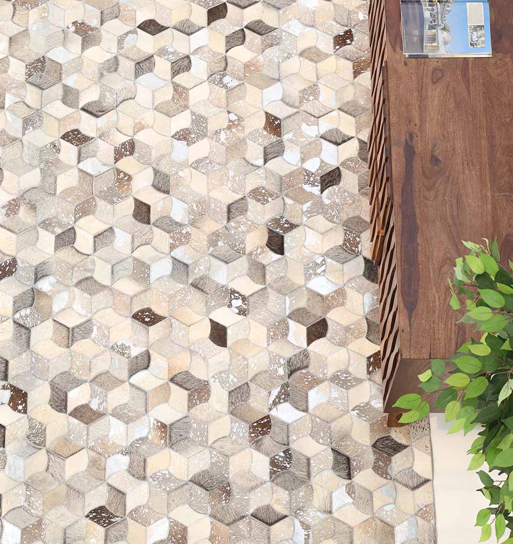 A floor with geometric hexagonal tiles in beige, cream, and brown sits next to a wooden cabinet and leafy plant, complemented by the RAMSHA HOME Amazing Bedroom & Hallway Grey Color Leather Rug - LR 007 for added texture.