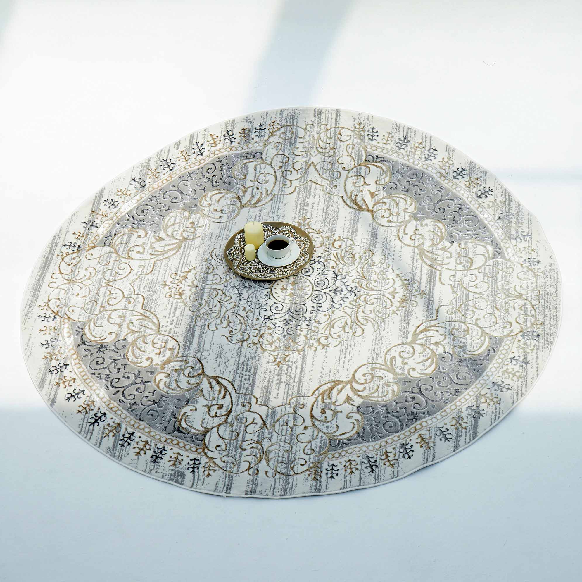 The RAMSHA HOME Light Grey Color NK36B 100% Polyester Silk Rug lies on a white floor. A gold-rimmed saucer, white coffee cup, and yellow pitcher sit at the center, all bathed in natural light.