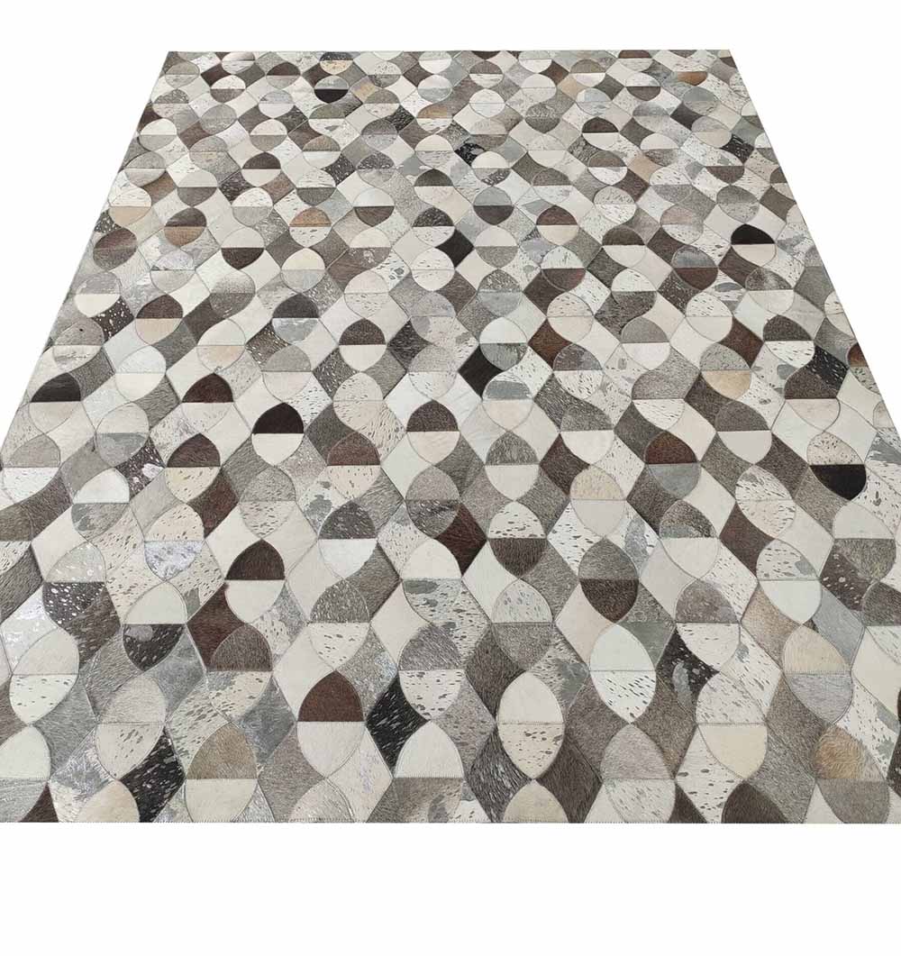 The RAMSHA HOME Delightful Modern Grey Color Leather Rug - LR 008 features interlocking circles and leaf shapes in gray, beige, brown, and white for a textured, mosaic-inspired look.