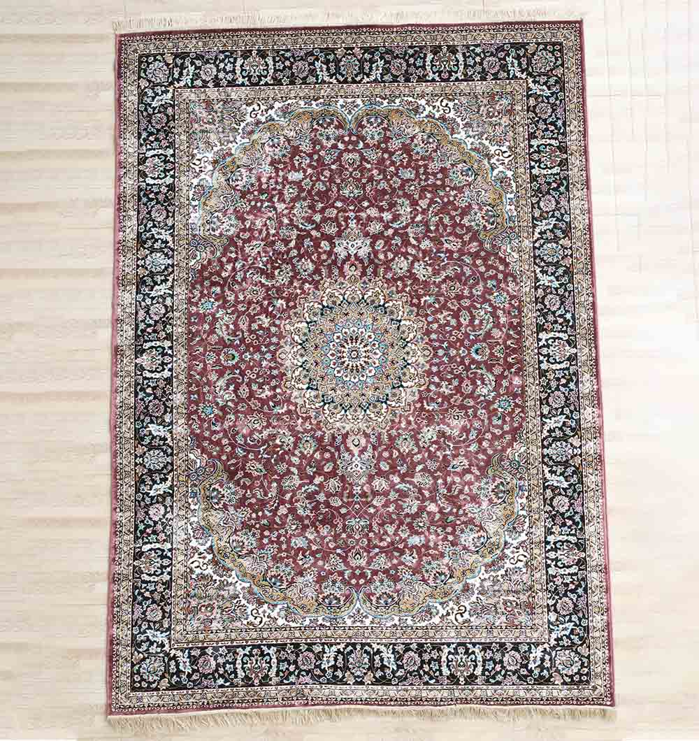 The RAMSHA HOME Persian Floral Medallion Burgundy Rug with Black Border – MMB 04 (150x210 cm) is placed on a light wooden floor.