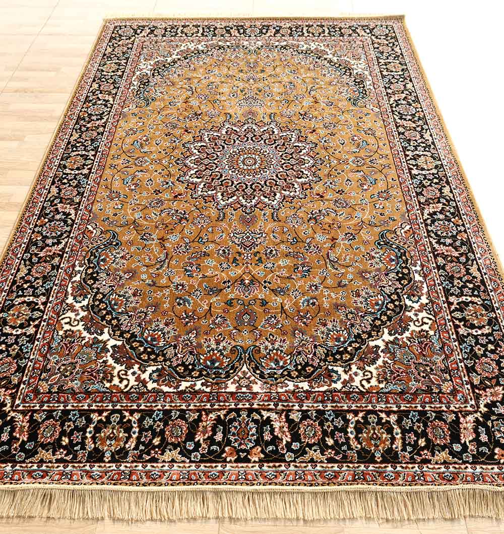 The RAMSHA HOME Persian Floral Medallion Rust & Black Border Rug – MMB 09 (175x275 cm) features an ornate floral design, central medallion, tan background, dark decorative border, and tassels, shown on a light wooden floor.