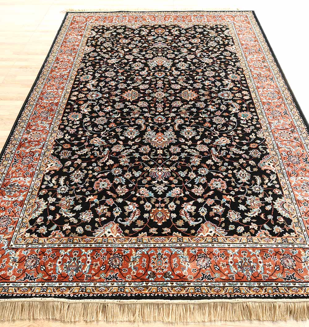 The RAMSHA HOME Persian Floral Black Rug with Red Border – MMB 10 (175x275 cm) features a classic design with a black center, intricate floral motifs, a wide red border, and beige fringe along the shorter edge visible at the bottom.