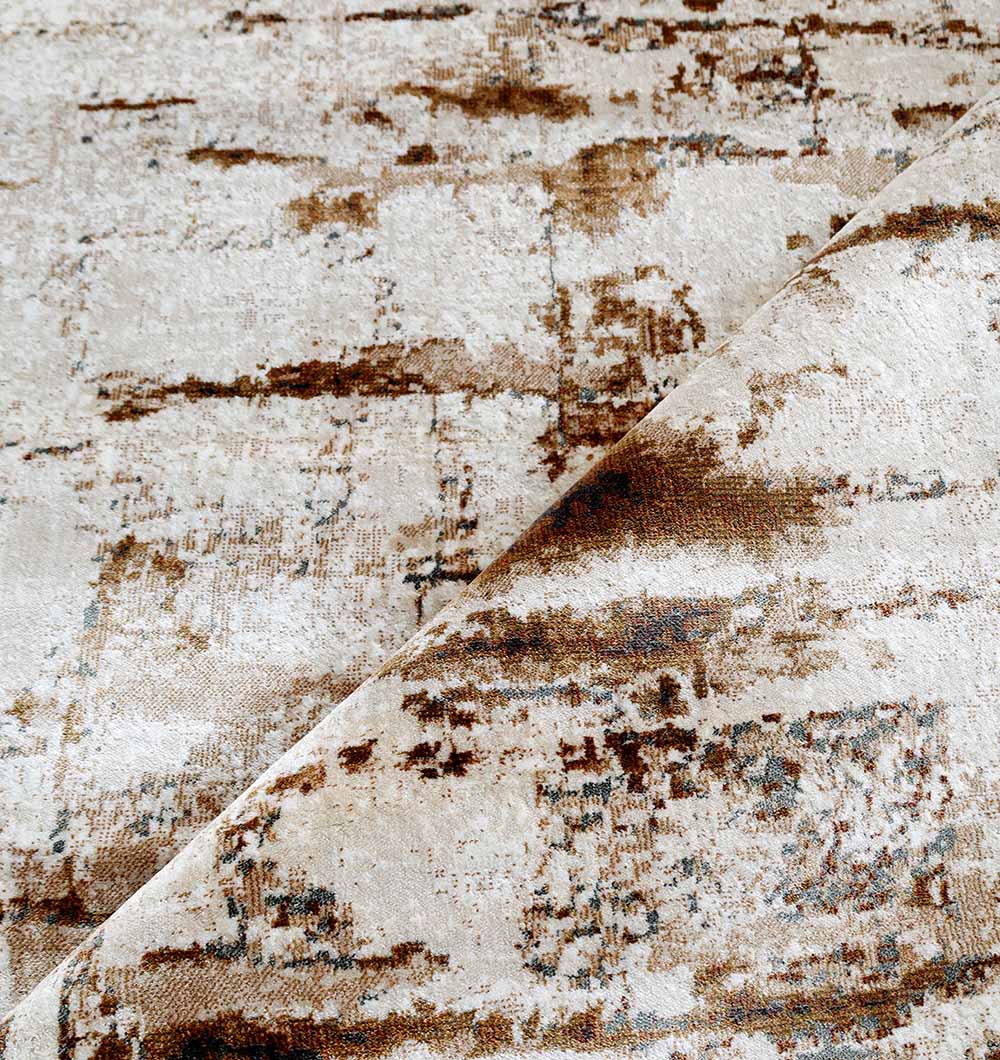 A close-up of the RAMSHA HOME Abstract Distressed Beige & Brown Rug – MMB 11 (235x330 cm) shows its intricate, weathered pattern. A folded corner reveals more of the modern neutral design in beige and brown tones.
