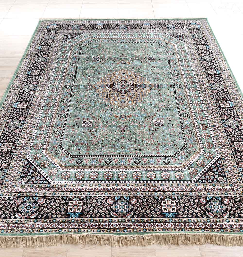The RAMSHA HOME Persian Medallion Mint Green & Black Border Rug – MMB 17 (265x365 cm) features intricate geometric and floral patterns in mint green, cream, black, and brown with ornate borders and beige fringe—a classic vintage style for any space.