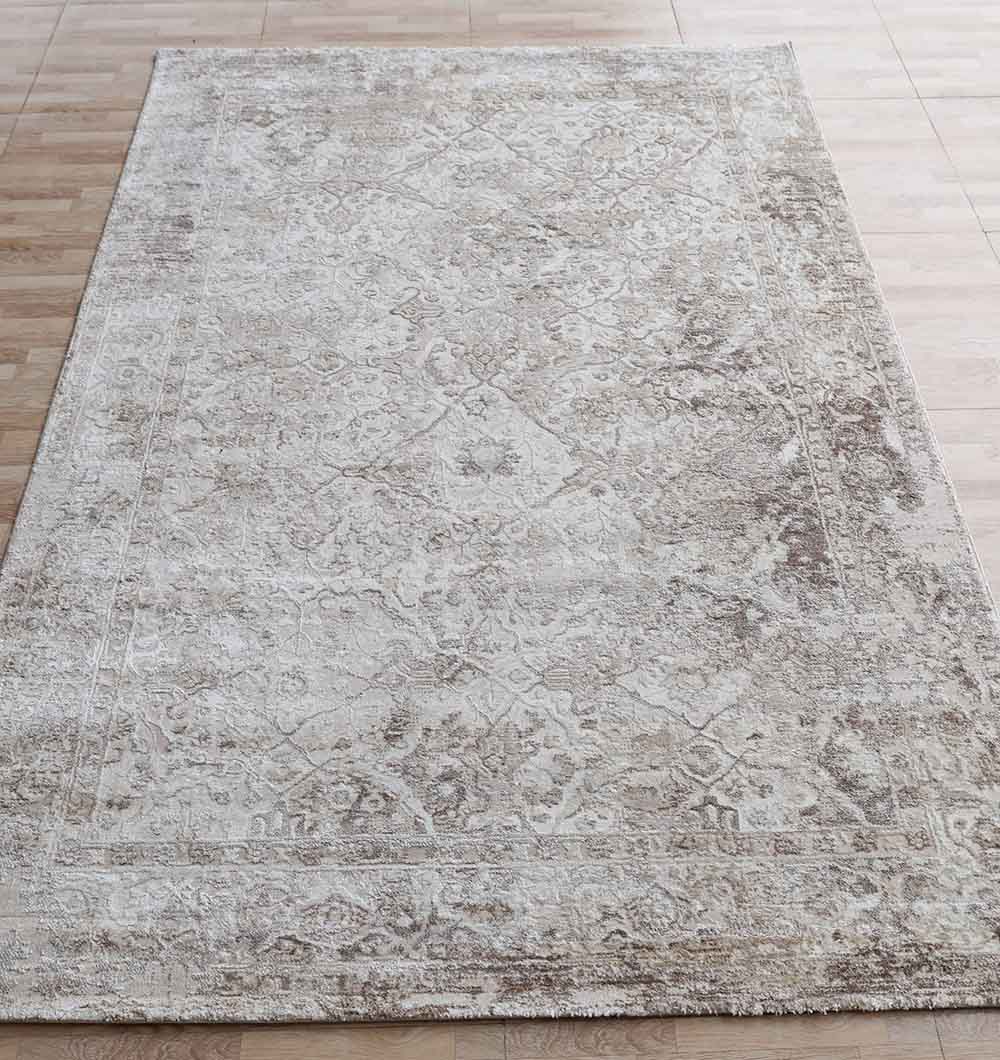 The RAMSHA HOME Modern Multi Abstract Machine-Made Carpet - MMB 078 (180 x 270 cm) features a beige and light brown geometric and floral pattern, displayed on a light wood floor.