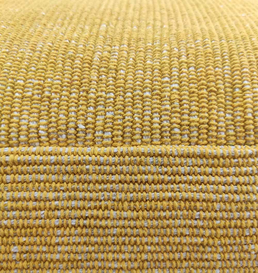Detailed view of yellow cotton pouf highlighting the intricate handmade weave and high-quality craftsmanship.