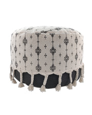 Handcrafted black and white cotton pouf with elegant fringes, adding a modern monochrome touch to any living space.