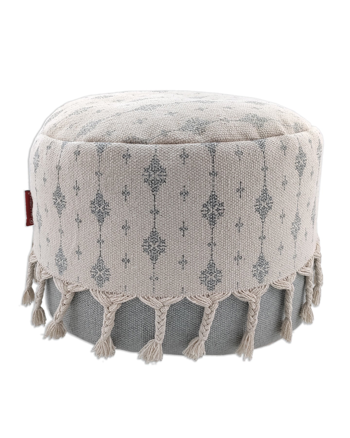 Handwoven white and grey cotton pouf featuring textured fringes, perfect for contemporary and cozy living spaces.