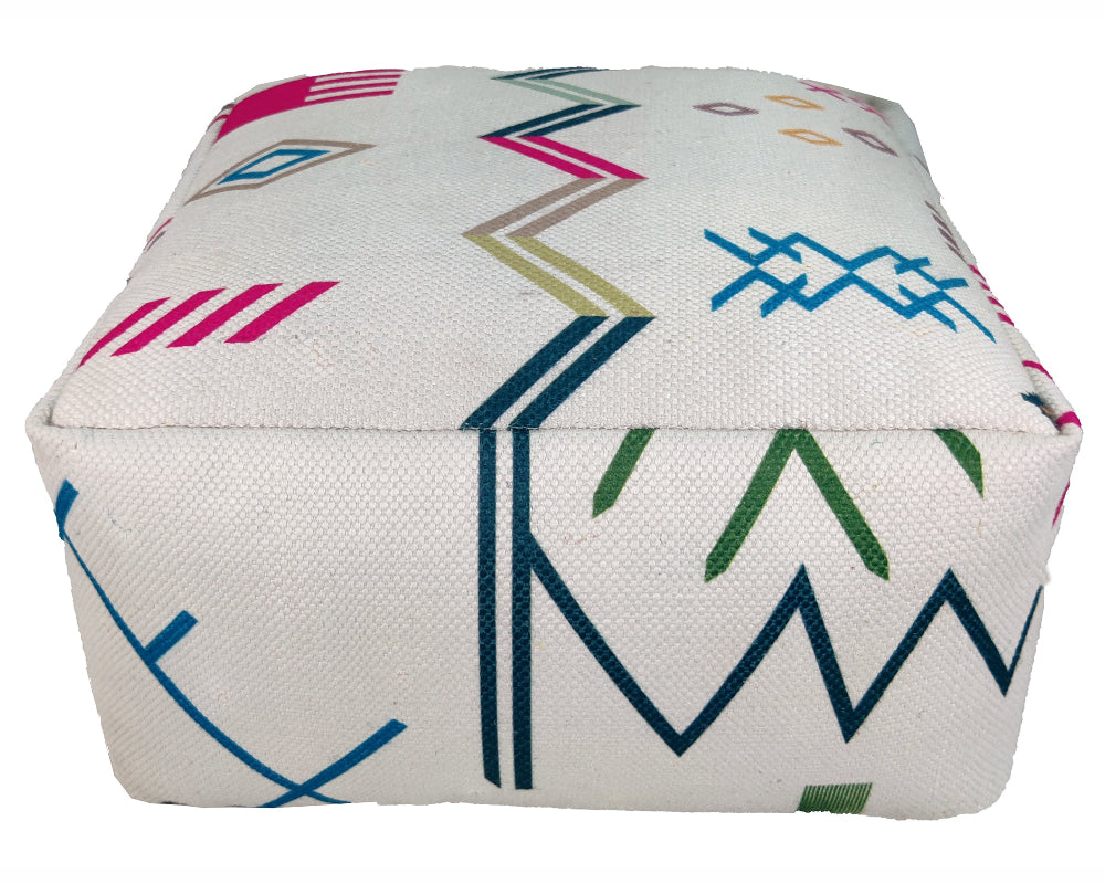 Handmade Multi Colored Polyester Pouf PF-103 placed in a modern living room setting, showcasing its vibrant striped design.