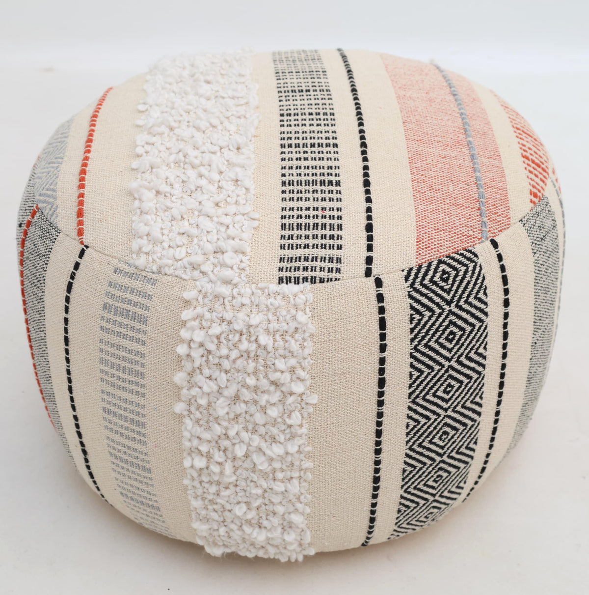 The Boho Modern Round Pouf With Insert PF 105 by RAMSHA HOME features vertical cream, black, gray, and orange stripes with textured white tufted accents. Perfect as extra seating or a stylish floor pouf in any space, it is shown on a plain white background.
