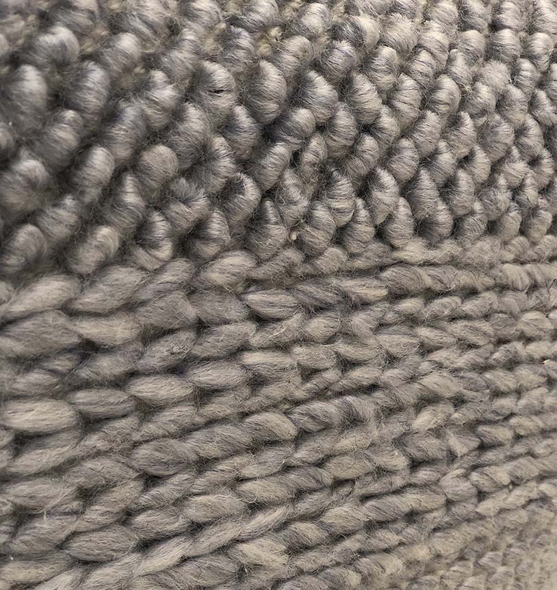Detailed view of handmade grey pouf PF-129 highlighting soft woven fabric