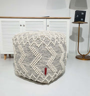 Square handmade pouf crafted from 90% wool and 10% cotton with soft natural tones for elegant interiors