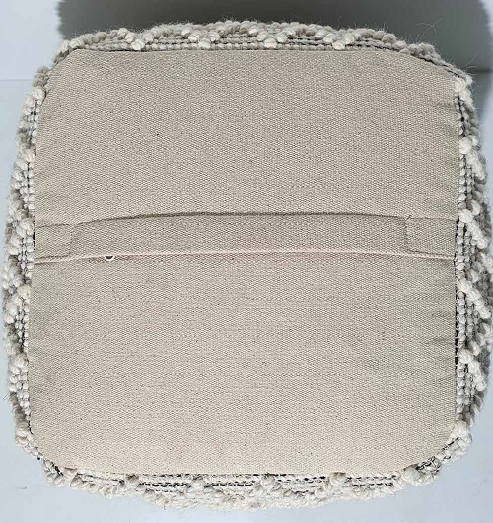 Backside view of handmade wool and cotton pouf PF-137 showcasing durable stitching and smooth base finish