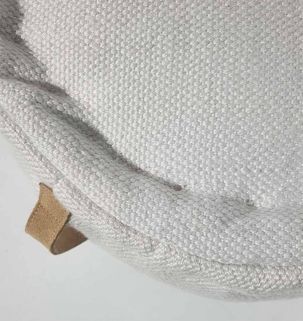 Detailed close-up of 100% polyester pouf PF-142 showing textured woven pattern and fine craftsmanship