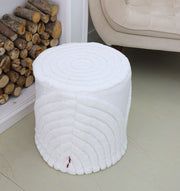 The RAMSHA HOME Luxury Handmade Pouf with Thermocol Bean Bag Insert PF-148, round and white with textured design, is placed on a light floor near stacked firewood and a beige chair, enhancing the space with premium home décor.