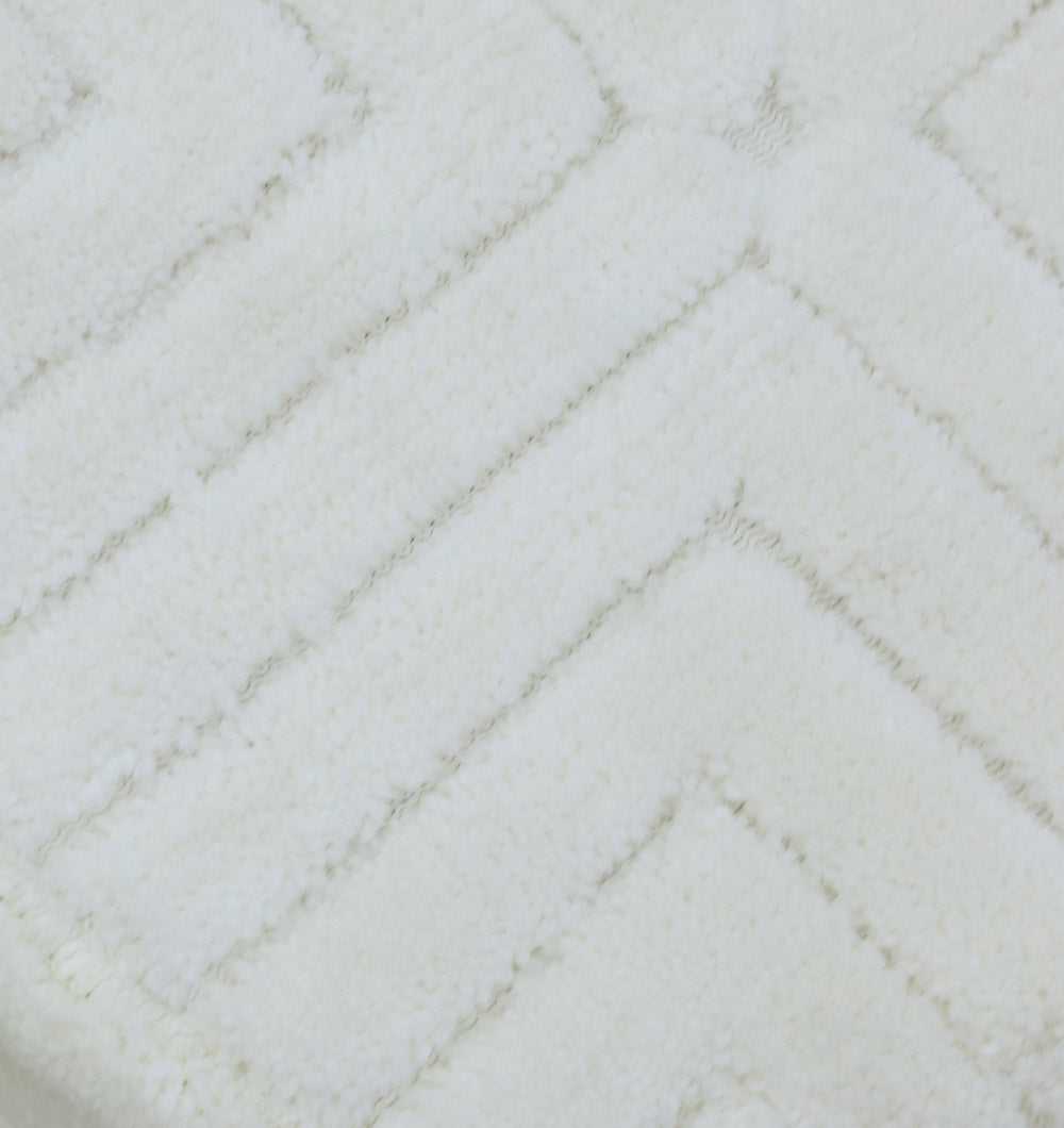 Close-up of the soft, white fabric with a subtle chevron pattern used in the RAMSHA HOME Luxury Handmade Pouf with Thermocol Bean Bag Insert PF-149—perfect for stylish, comfortable extra seating in any space.