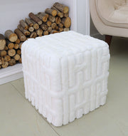 The RAMSHA HOME Luxury Handmade Pouf with Thermocol Bean Bag Insert PF-151, featuring a white geometric texture, sits on a light floor near a beige armchair and stacked firewood, adding premium décor to the space.