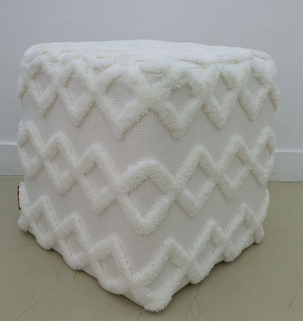 The RAMSHA HOME Handmade Pouf with Insert (White, PF-153) features a premium zigzag diamond pattern and sits on a beige floor against a plain white wall.
