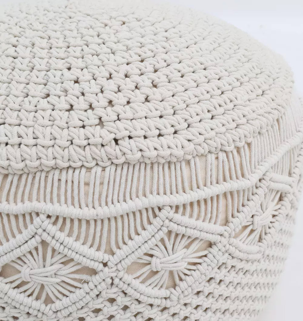 The RAMSHA HOME Boho Macrame Pouf White Round PF-159 features an intricate, cream-colored woven macramé cover with textured diamond patterns, making it a stylish and comfortable floor cushion.