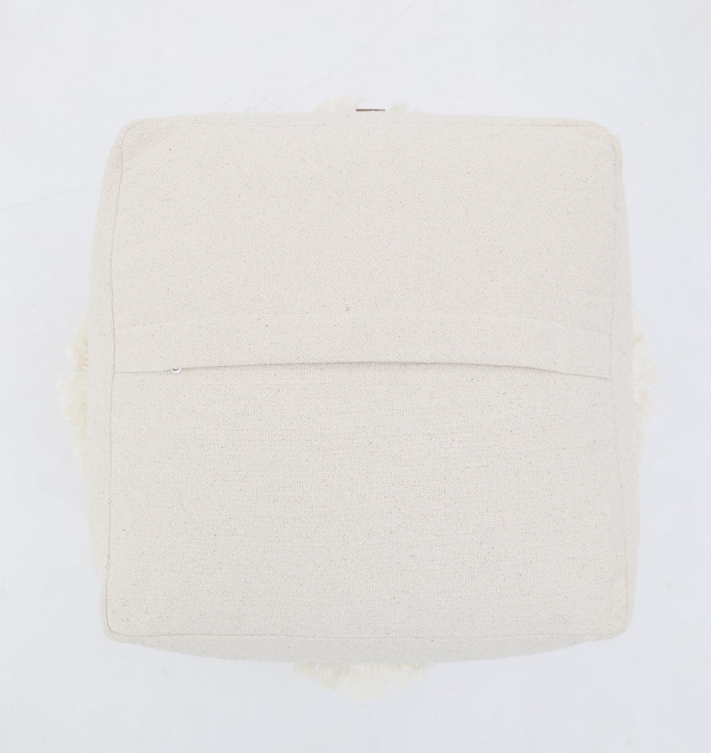 A top-down view of the Ivory Handmade Cotton Pouf with insert PF 166 by RAMSHA HOME—a square, off-white accent featuring a rear pocket seam on a plain white background; a stylish decorative piece for any space.