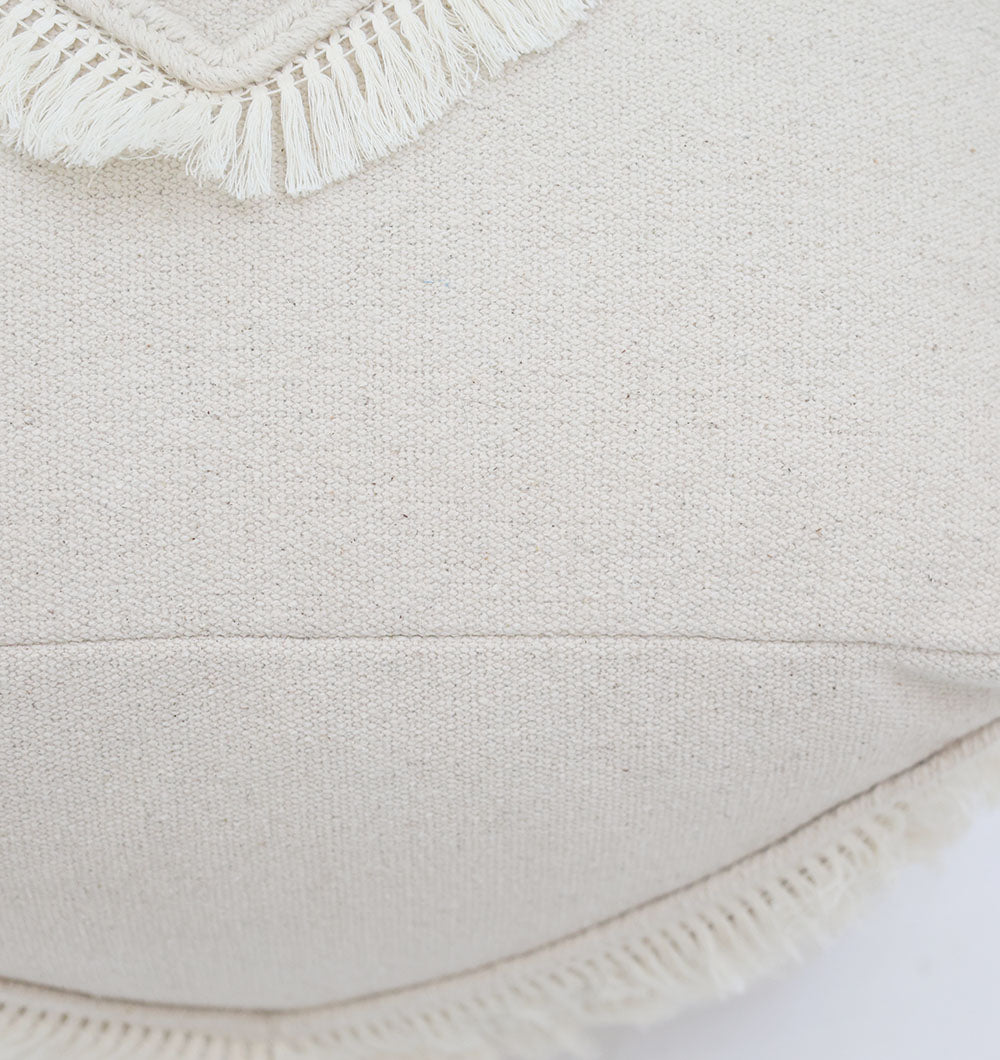 Close-up of the RAMSHA HOME Ivory Handmade Cotton Pouf with insert PF 166, showcasing decorative fringe trim and a slightly textured, natural look—an elegant accent for your home décor.
