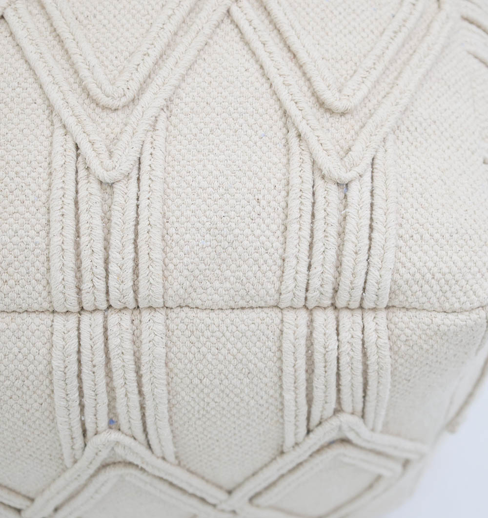 Close-up of a cream-colored textured fabric with raised diamond and chevron patterns, perfect as a decorative accent on the RAMSHA HOME Ivory Nordic Bliss Cotton Pouf with insert PF 168.