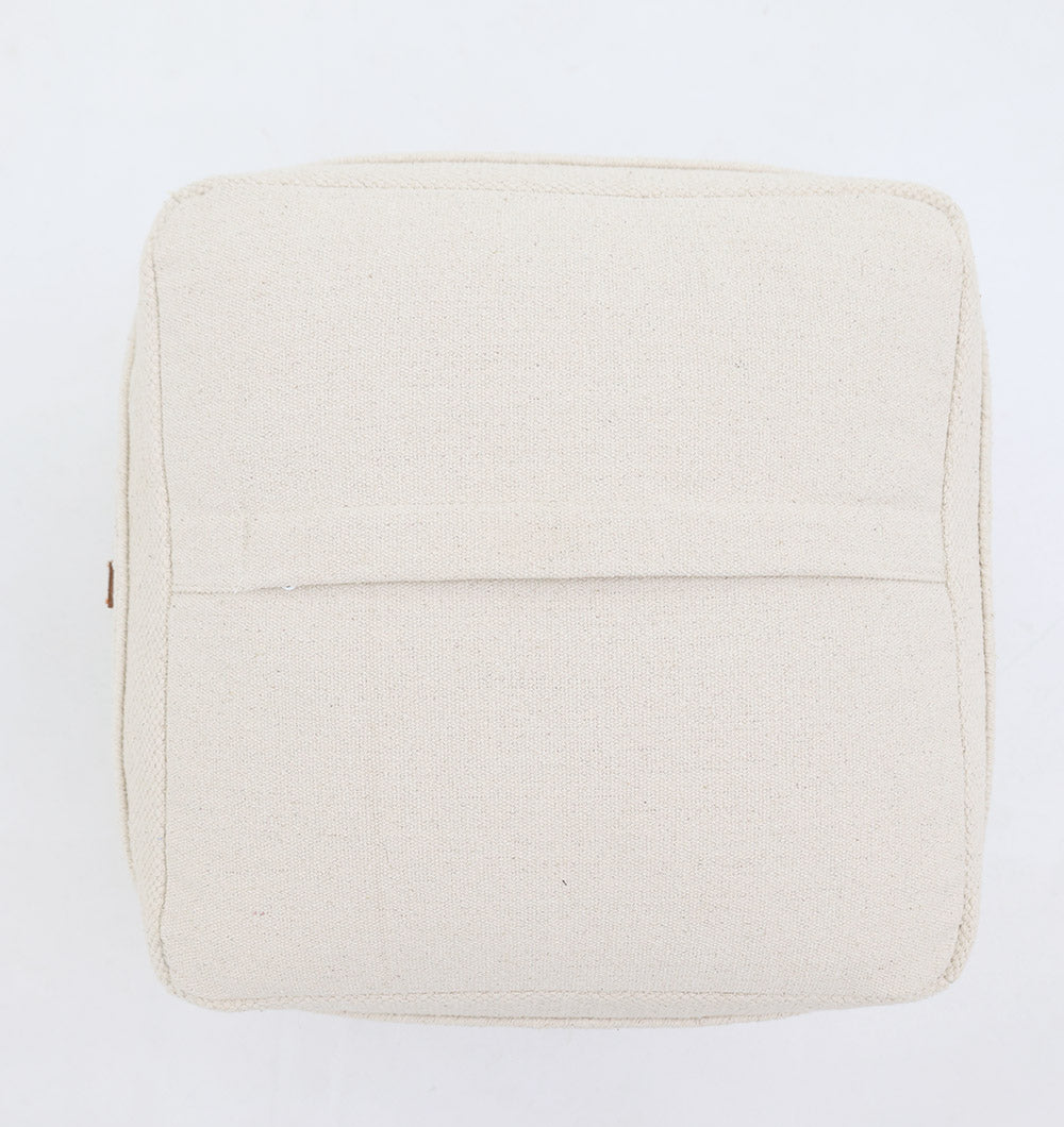 A top-down view of the Ivory Nordic Bliss Cotton Pouf with insert PF 169 by RAMSHA HOME—a square, beige cushion with a stitched seam and center flap—ideal as a chic decorative accent, displayed on a plain white background.