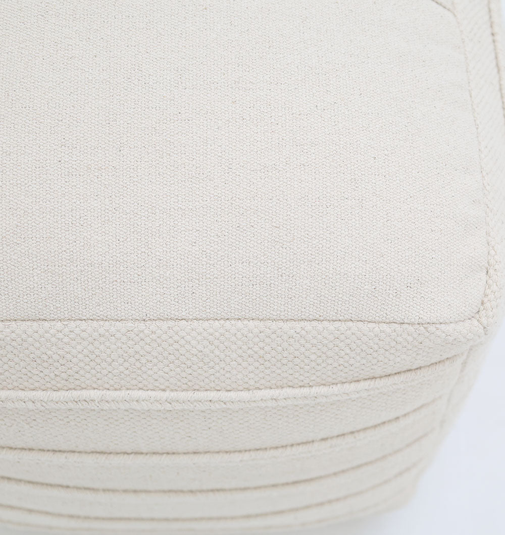 Close-up of the Ivory Nordic Bliss Cotton Pouf with insert PF 169 by RAMSHA HOME, highlighting its cream-colored textured cotton upholstery and visible stitching—a chic decorative accent for any room.