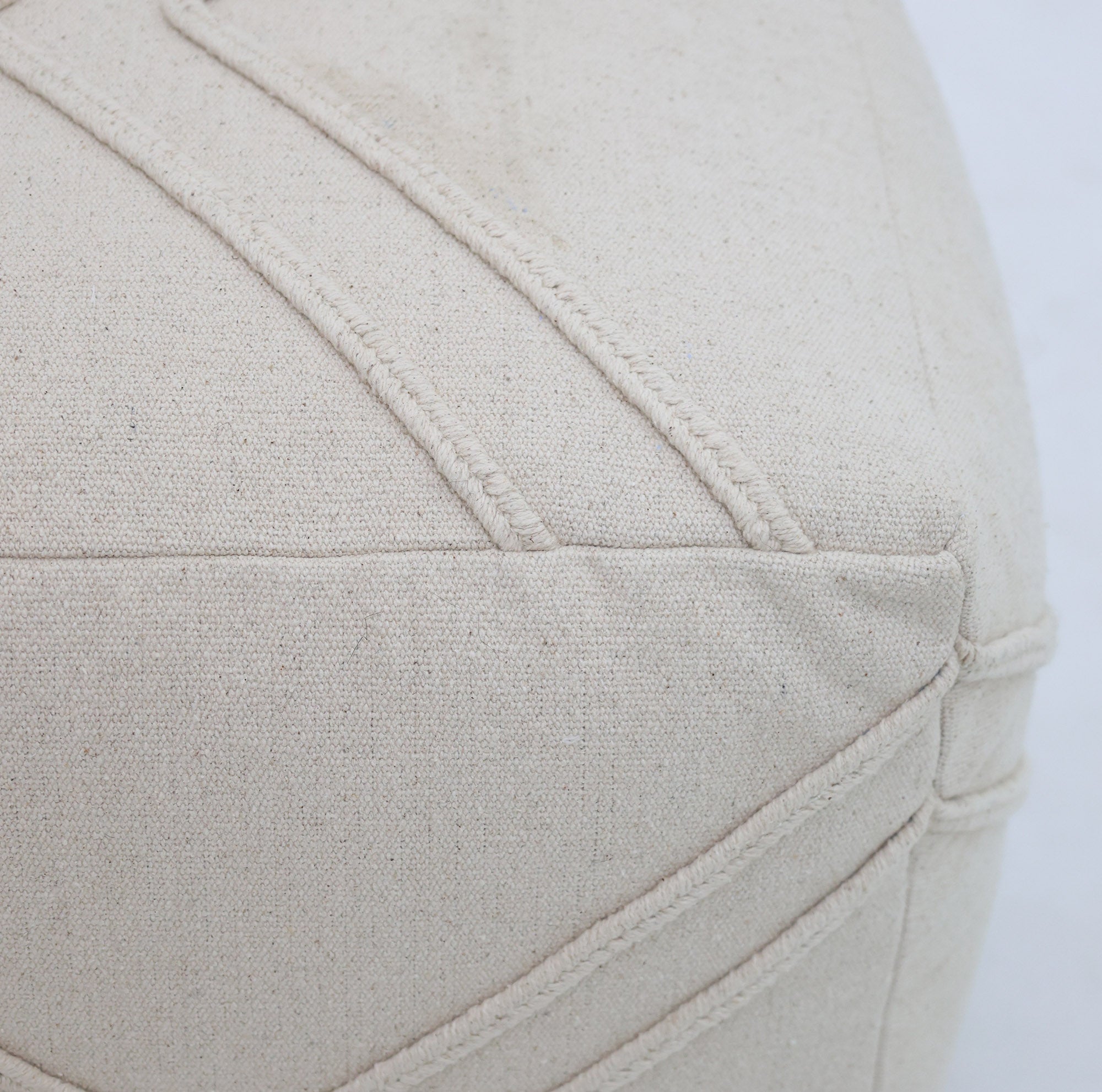 Close-up of the RAMSHA HOME Ivory Nordic Bliss Cotton Pouf with insert PF 172, showcasing textured stitching, detailed seams, and fabric grain—an elegant decorative accent for any space.