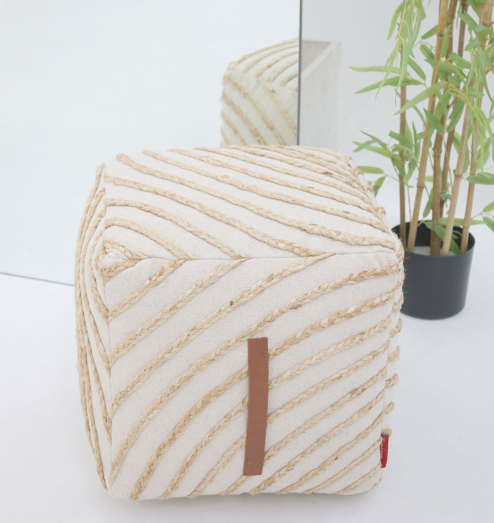 The Aurora Cotton Floor Pouf with insert PF 173 by RAMSHA HOME sits in front of a mirror next to a green potted plant, creating a stylish modern décor look. The mirror reflects both the pouf and plant for added dimension.
