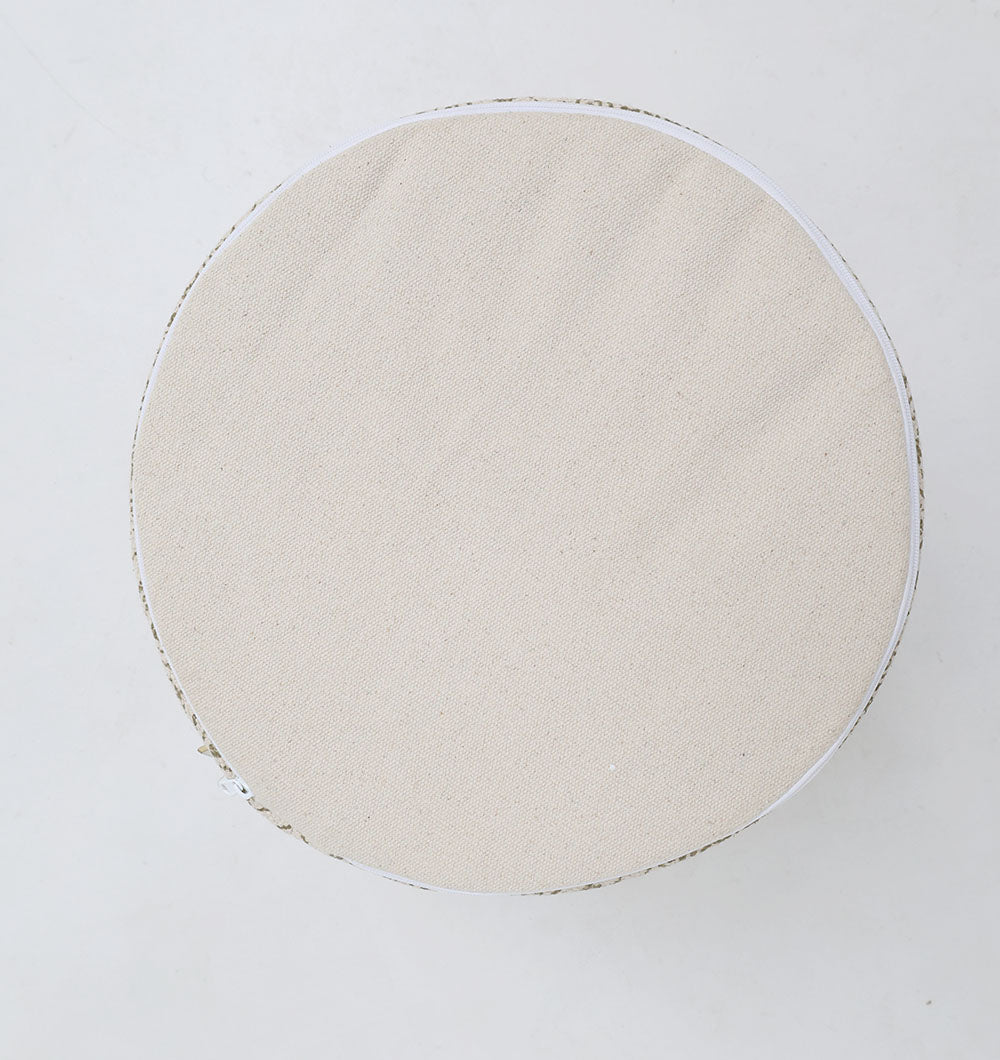 The RAMSHA HOME Stylish cotton printed pouf with decorative tassels PF 174 is a round, beige floor cushion featuring a fabric cover, shown from above on a plain white background.