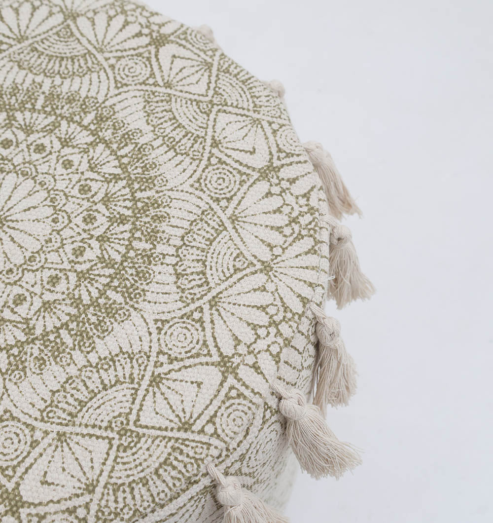 A close-up of the RAMSHA HOME Stylish cotton printed pouf with decorative tassels PF 174, showcasing an intricate green mandala design and cream tassels around the edge, displayed on a plain white background.