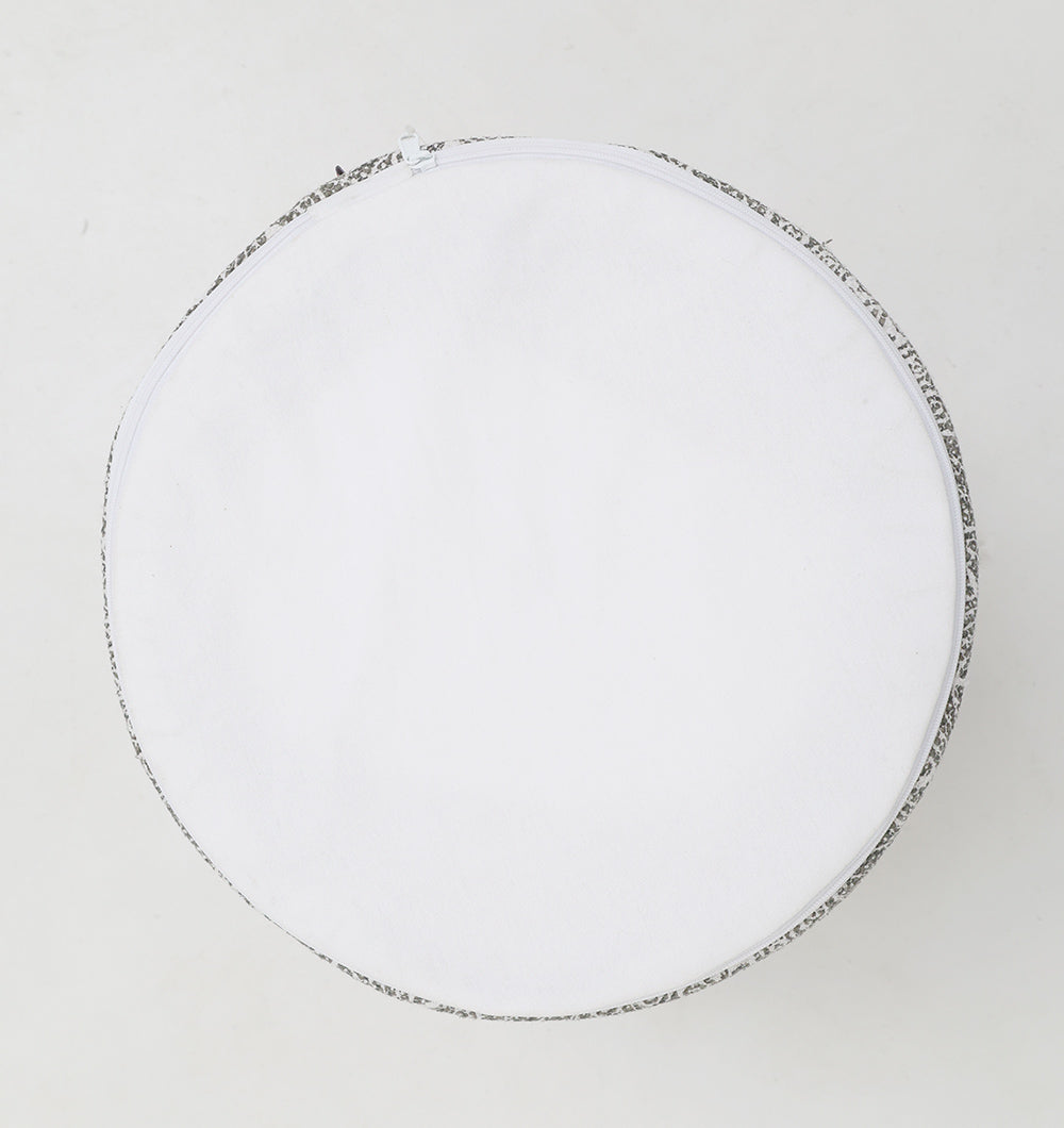 A round, white Stylish cotton printed pouf with decorative tassels (PF 174) by RAMSHA HOME, viewed from above on a light background; this versatile piece can serve as a floor cushion or be used as a laundry or storage bag.