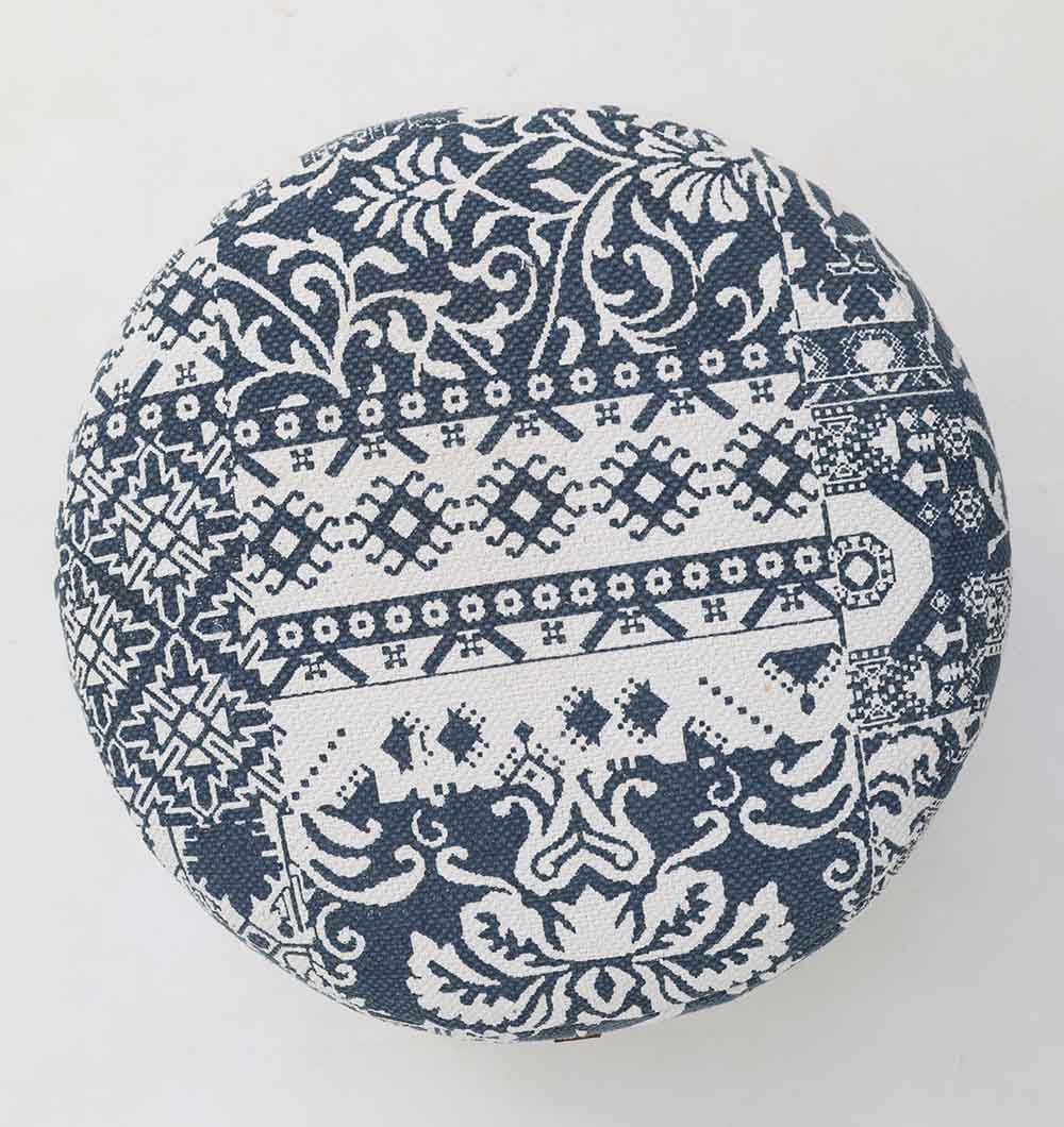 The RAMSHA HOME Boho Printed Round Pouf with Insert PF 176 features a patchwork of navy blue and white floral and geometric designs—ideal for adding charm to your home décor.